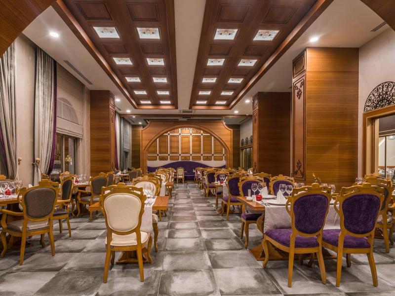 Elegant dining room with classic chairs and wood paneling.