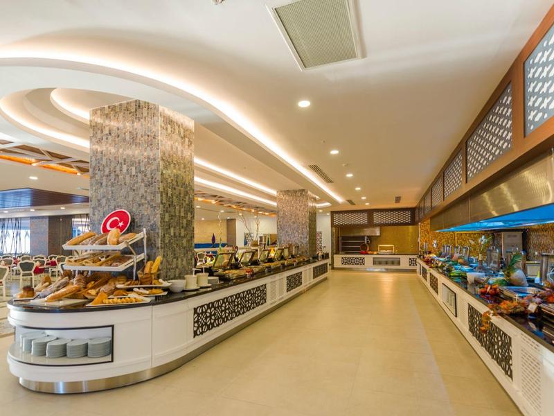 Bright and modern buffet restaurant with a variety of dishes and stylish interior design.
