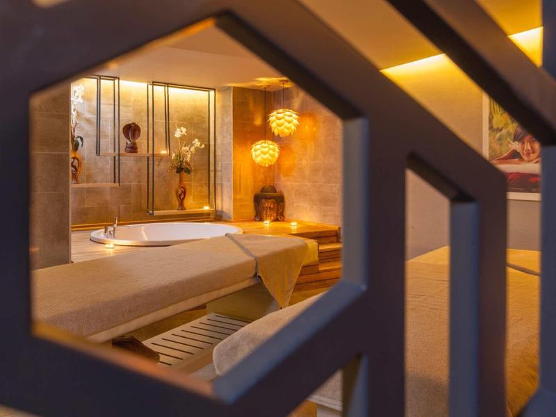 Cozy hotel room with warm lighting and modern decor.