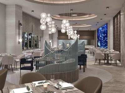 Modern restaurant met elegante zitgedeeltes, ronde tafels en opvallende bolverlichting.