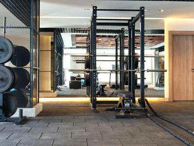 Modern gym with weights and workout equipment in a hotel