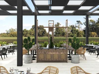 Nowoczesny zewnętrzny obszar hotelu z stołami i krzesłami pod szklanym dachem z widokiem na zielony krajobraz.