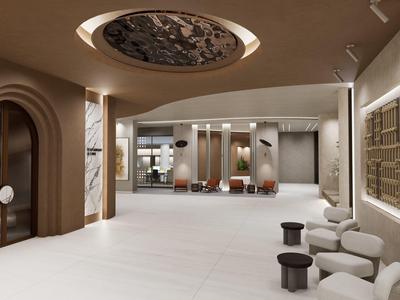 Nowoczesna recepcja hotelowa z miejscami do siedzenia i dekoracyjnym oświetleniem sufitowym.