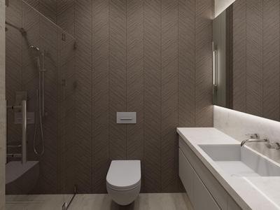 Baño moderno con inodoro, lavabo y ducha a ras de suelo en tonos neutros.