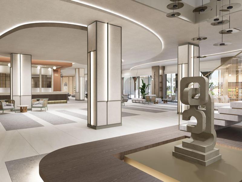 Nowoczesna lobby hotelowa z okrągłymi kolumnami, minimalistycznym oświetleniem i dekoracjami.