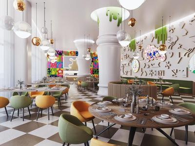 Modern restaurant met kleurrijke stoelen, gedekte tafels en een grote centrale pilaar.
