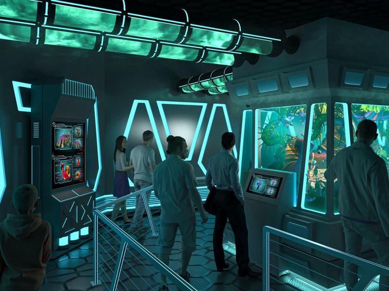 Interieur van een donkere aquariump ruimte met meerdere mensen die onderwaterervaringen beleven.