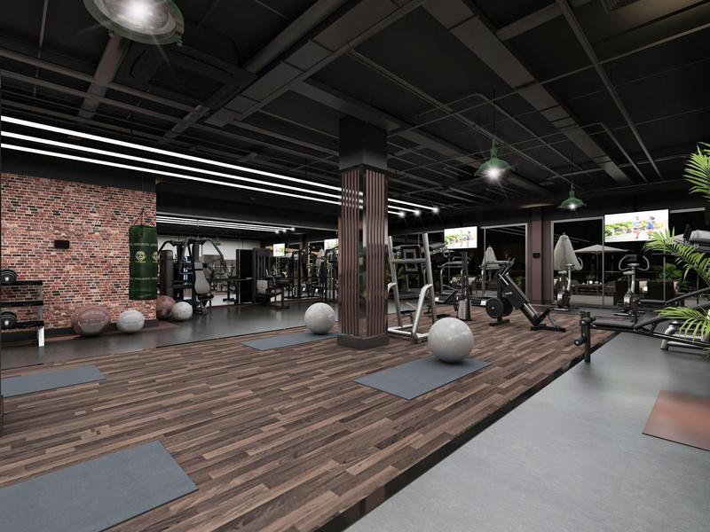 Palestra moderna dell'hotel con pavimento in legno, attrezzature per il fitness e tappetini per yoga.