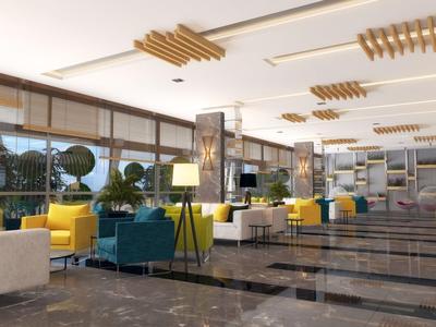 Moderne hotel lobby met comfortabele banken, lampen en grote ramen met uitzicht.