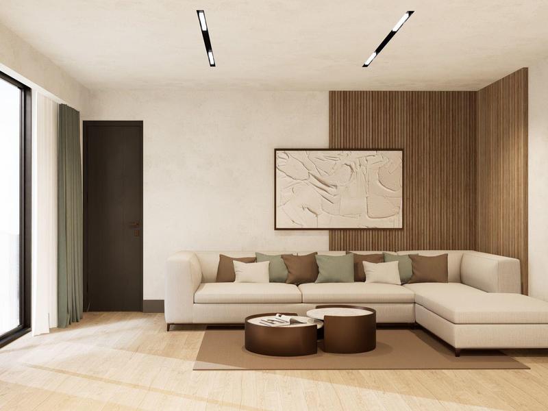 Moderner Wohnraum mit beige Ecksofa, braunen Hockern, Holzpaneel und großem Fenster.