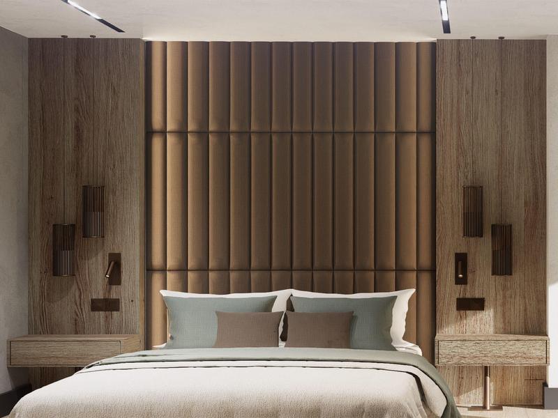 Modernes Schlafzimmer mit braunem Polsterkopfteil, zwei Nachttischen und reduziertem Wandschmuck.