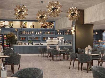 Moderner Hotel-Lounge-Bereich mit stilvollen Sitzgelegenheiten und dekorativen Kronleuchtern.