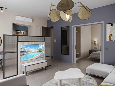 Moderní obývací prostor s pohovkou, TV a přístupem do ložnice v hotelovém pokoji.