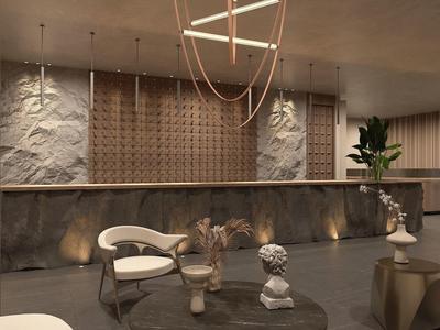 Moderner Raum mit strukturierter Wand, dekorativen Skulpturen und weicher Beleuchtung in warmen Tönen.