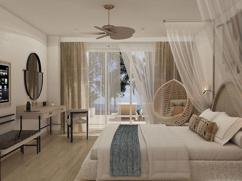 Helles Schlafzimmer mit großem Bett, Holzfußboden, Hängesessel und Glas-Schiebetür zum Balkon.