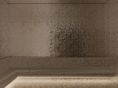 Simple, minimalist hotel room wall with muted brown tone and integrated indirect lighting.
