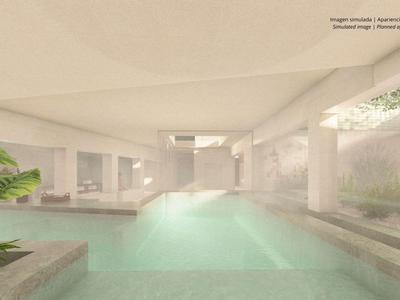 Indoor wellness pool area in a bright, modern spa with plants and seating areas.