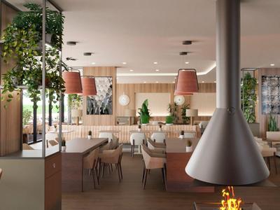 Modern eingerichteter Hotel-Loungebereich mit Kamin, Pflanzen und gemütlichen Sitzplätzen.