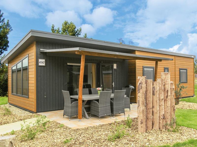 Modern holiday home with terrace and garden, perfect for a relaxing vacation.