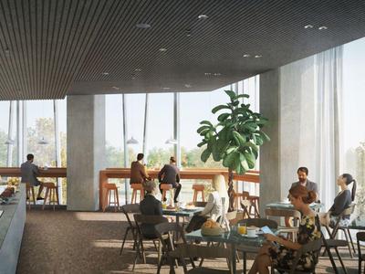 Hell beleuchteter Hotel-Loungebereich mit großen Fenstern, Sitzplätzen und Pflanzen.