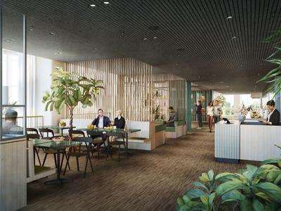 Moderner Hotel-Loungebereich mit Sitzgelegenheiten, Pflanzen und großem Fenster für Tageslicht.