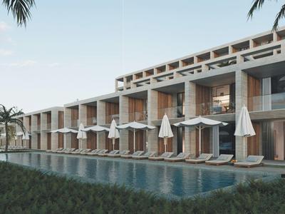 Moderner Hotelkomplex mit Zimmern und Privatpools, umgeben von Palmen am Abend.