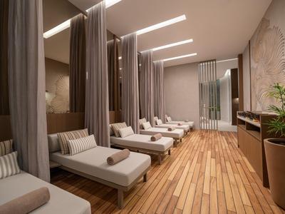 Eleganter Wellnessbereich mit bequemen Liegen, hölzernen Boden und abgetrennten Bereichen.