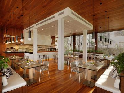 Modern restaurant with wooden ceiling, glass tabletops, and minimalist furnishings.