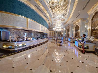 Luxurious hotel lobby with shiny marble floor and chandeliers