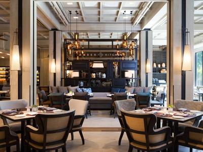 Elegant restaurant interior with stylish tables and cozy lighting.