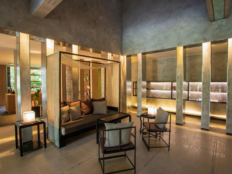 Elegant hotel lounge area with cozy seating and ambient lighting.