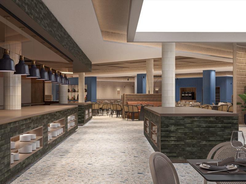 Área de restaurante de hotel moderno con detalles de piedra y luminarias negras.