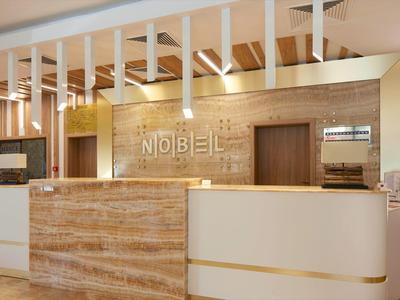 Moderner Empfangsbereich mit hellen Holztönen, weißer Theke und beleuchtetem "NOBEL"-Schriftzug.