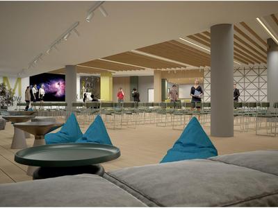 Salón moderno de hotel con asientos cómodos y vista a un pasillo con paredes de vidrio.