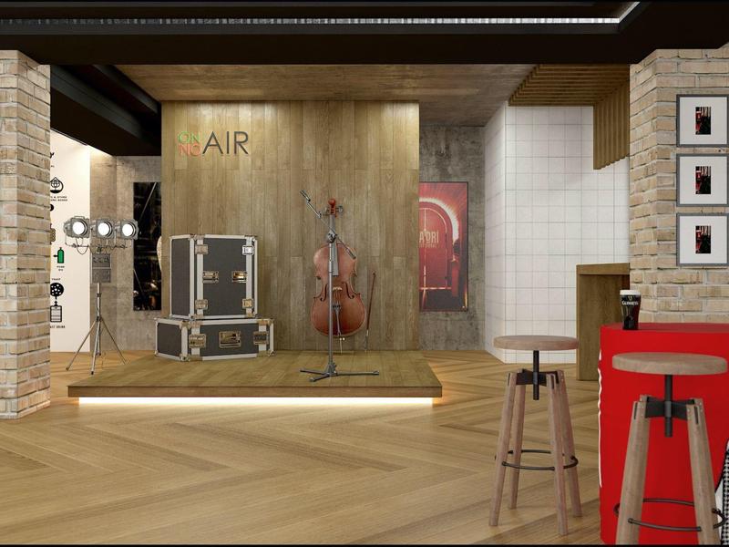 Área de hotel moderna con revestimiento de madera, barra roja y elementos decorativos en paredes.