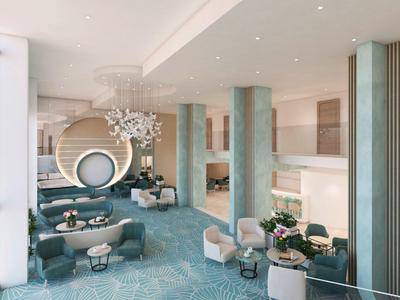 Luxuriöser, heller Lounge-Bereich mit blauen Teppich, runden Sesseln und moderner Beleuchtung.