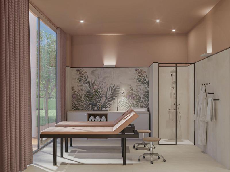 Sala de bienestar moderna con camilla de masaje, cabina de ducha y pared de plantas