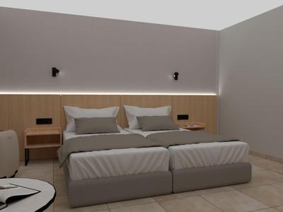 Modernes Schlafzimmer mit großem Doppelbett, neutralen Farben und minimalistischer Einrichtung.
