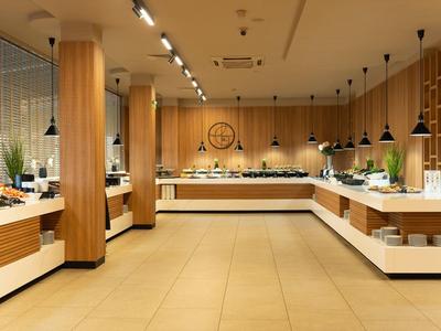 Bright, modern buffet area with wooden panels and a variety of dishes.