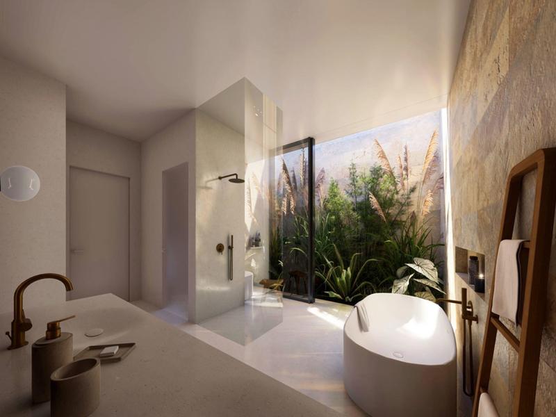 Modernes Badezimmer mit freistehender Badewanne und Blick auf einen begrünten Außenbereich.