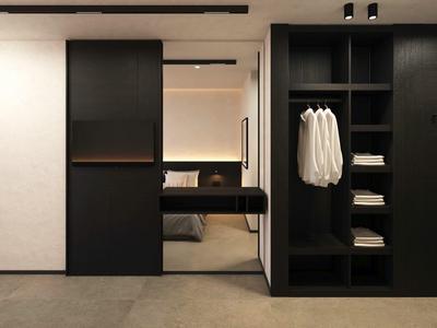 Moderner, schwarzer begehbarer Kleiderschrank mit Regalen, Kleiderstangen und indirekter Beleuchtung.