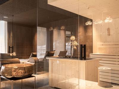 Moderna hall dell'hotel con poltrona elegante, bancone e pareti in vetro con luce calda.