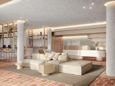 Helle Hotellobby mit gemütlichen Sitzgelegenheiten und moderner Einrichtung.