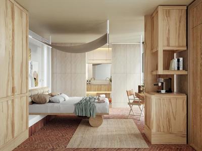 Modern gestaltetes Hotelzimmer mit Holzmöbeln, Bett und Teppichen in neutralen Tönen.
