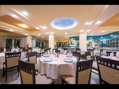 Elegant restaurant with round set tables and sky ceiling light feature