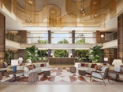 Moderne Hotellobby mit bequemen Sesseln, grünen Pflanzen und einer großzügigen Rezeption.
