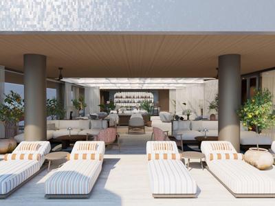 Modernes Hotel mit Liegestühlen, Säulen und Sitzbereich im Freien unter Dach.