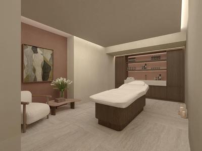 Moderní, klidný spa pokoj s masážním lehátkem, křeslem a uklidňujícím dekorem.