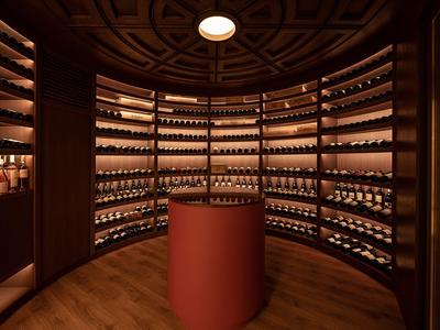 Cave à vin ronde élégante avec étagères en bois et éclairage tamisé dans un hôtel.