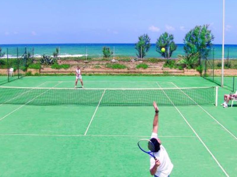 Bright hotel playroom with colorful furniture, toys, and a large red octopus plush.